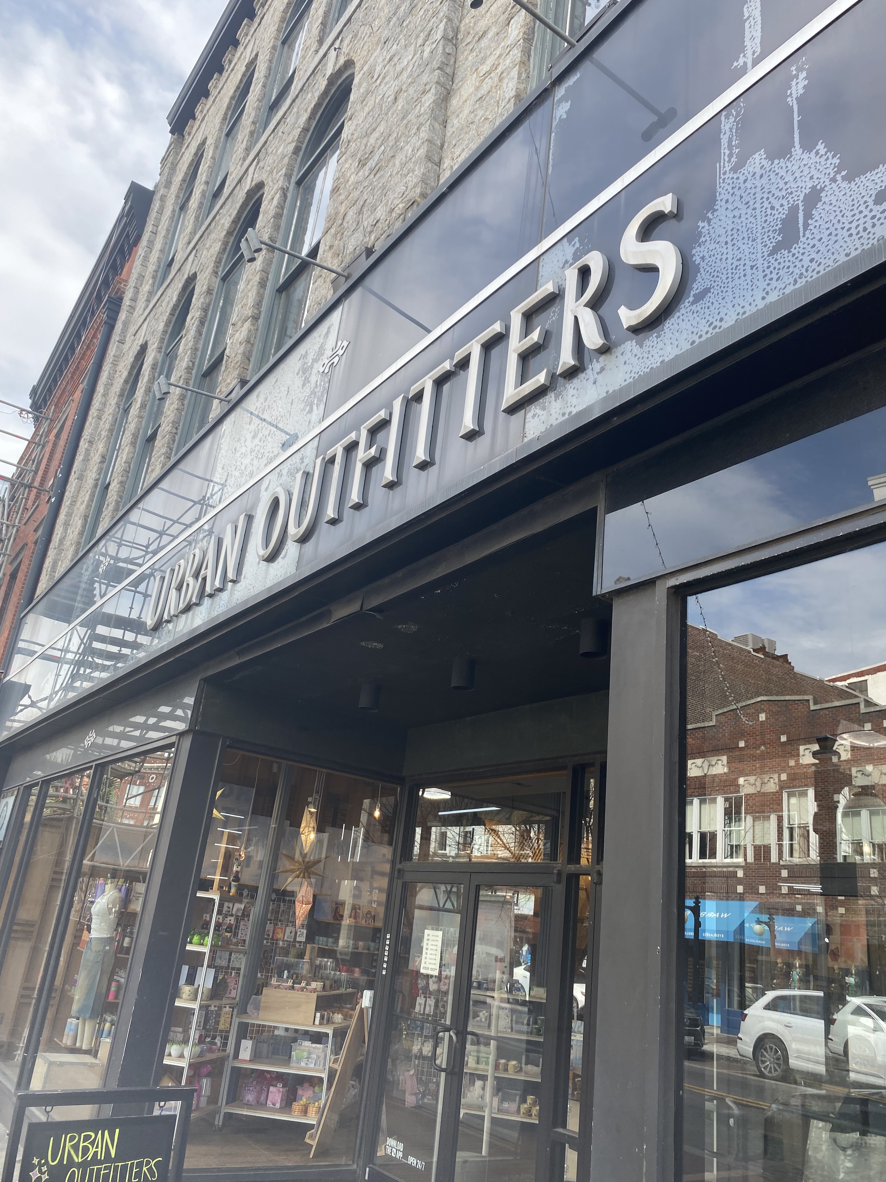 A warning sign on an electrical box with a yellow panel and black text, indicating danger of electrostatic discharge.
